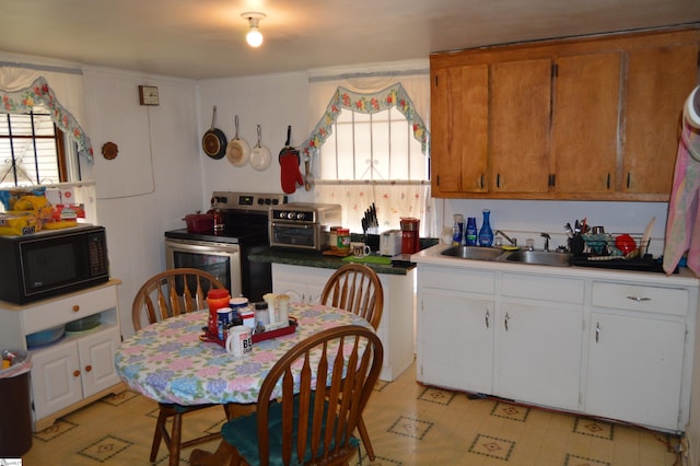 kitchen featuring sink and stainless steel electric stove