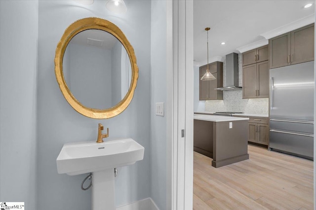 bathroom featuring backsplash and wood-type flooring