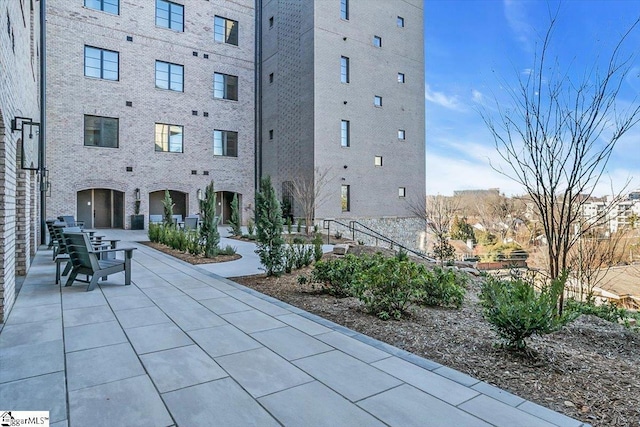 view of property's community with a patio