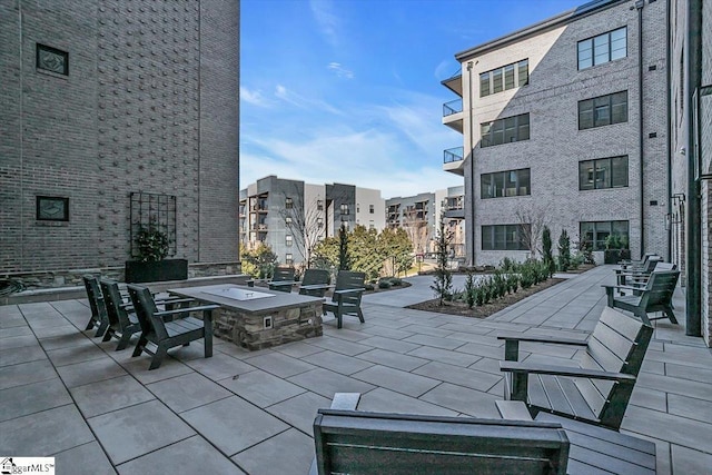 view of patio featuring an outdoor fire pit