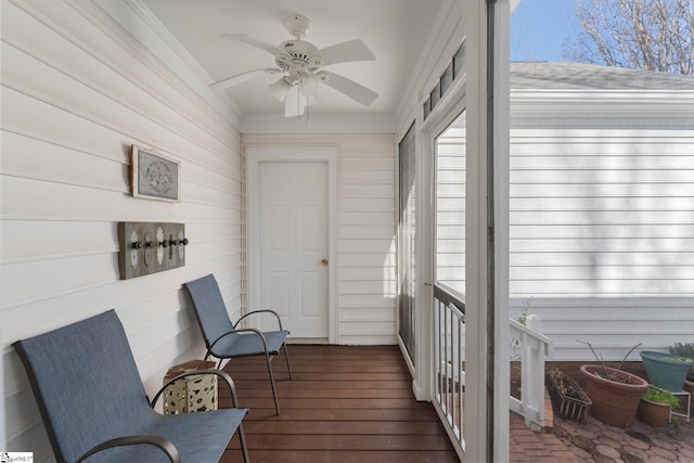 sunroom featuring ceiling fan