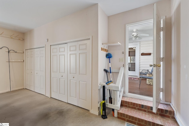 interior space with ceiling fan