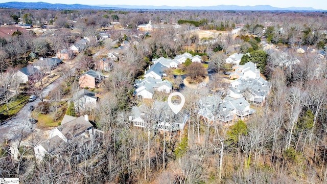 birds eye view of property featuring a mountain view