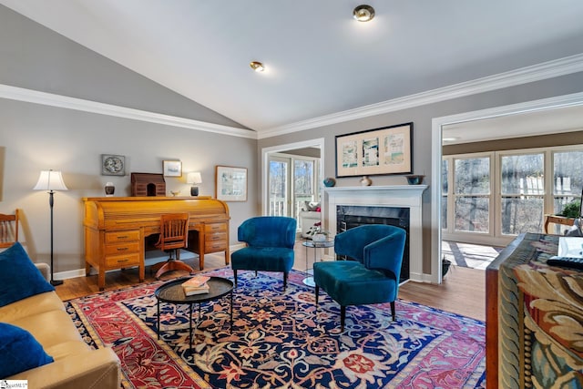 living room featuring ornamental molding, a fireplace, vaulted ceiling, and hardwood / wood-style floors