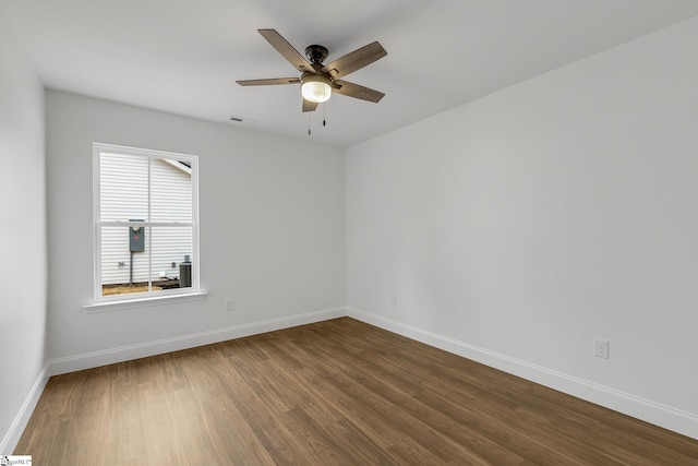 spare room featuring wood-type flooring and ceiling fan