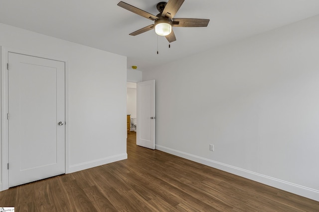 unfurnished bedroom featuring dark hardwood / wood-style floors and ceiling fan