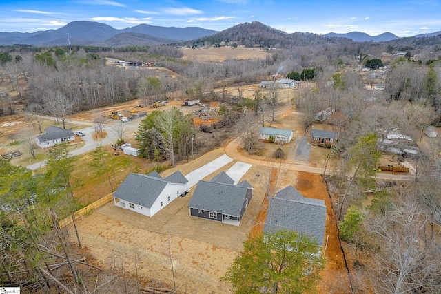 birds eye view of property with a mountain view