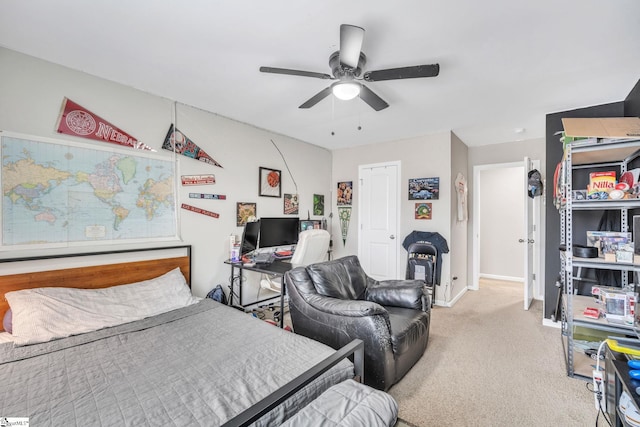 bedroom featuring light colored carpet and ceiling fan