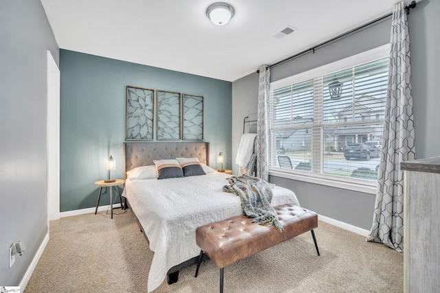 bedroom with light colored carpet