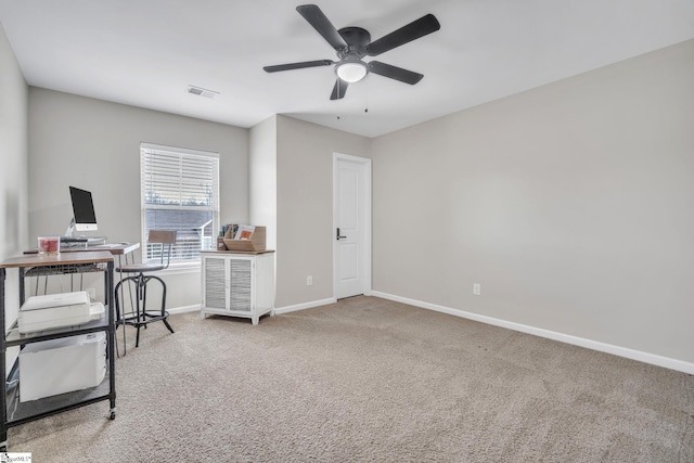 office space featuring ceiling fan and carpet