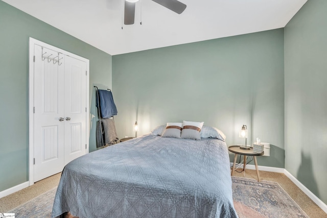 bedroom featuring ceiling fan, carpet floors, and a closet