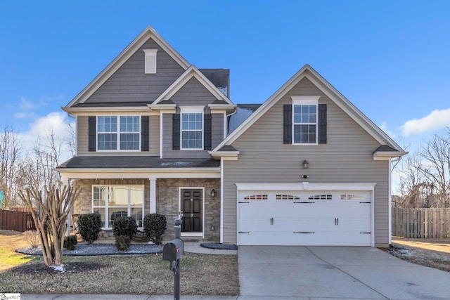 view of front of home with a garage and covered porch