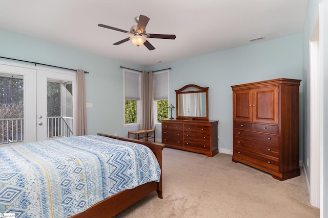 carpeted bedroom with french doors, ceiling fan, and access to outside