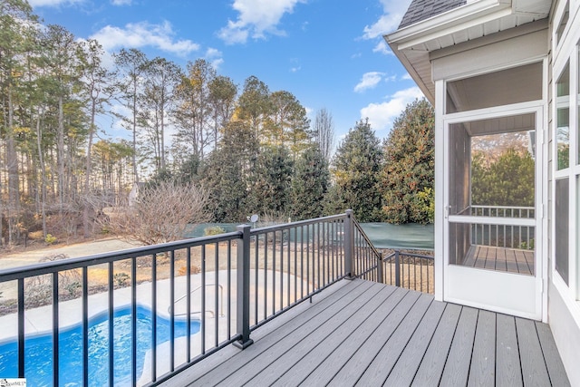 wooden deck featuring a sunroom