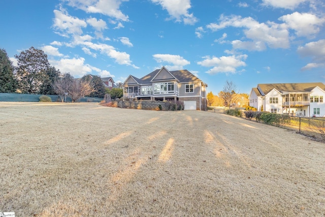 front of property featuring a garage and a front yard