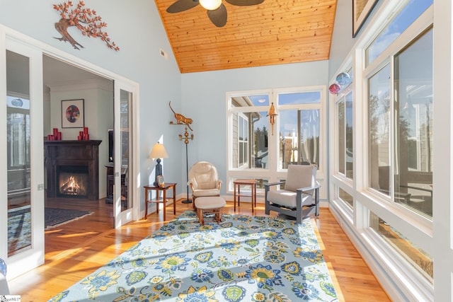 sitting room featuring high vaulted ceiling, wooden ceiling, ceiling fan, and light wood-type flooring