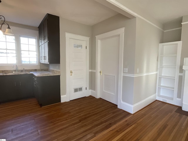 kitchen featuring sink and dark hardwood / wood-style floors