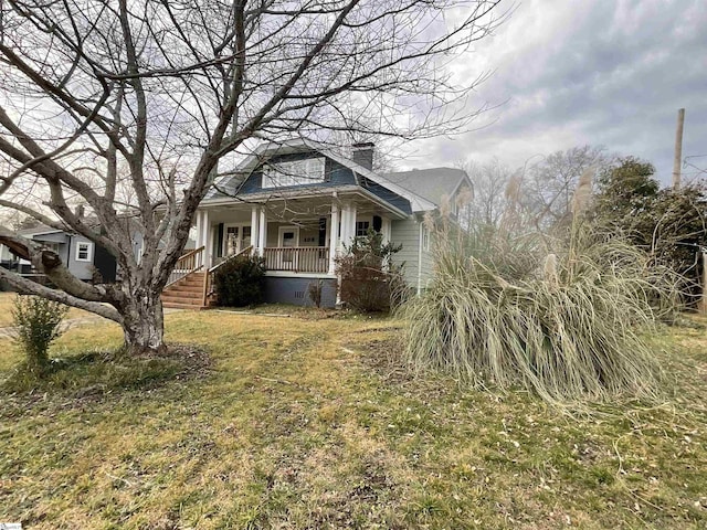 view of front of house featuring a front yard and a porch