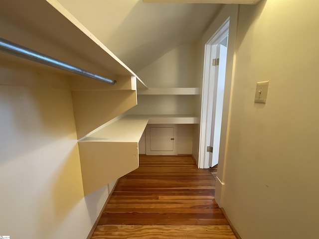 hallway with hardwood / wood-style floors