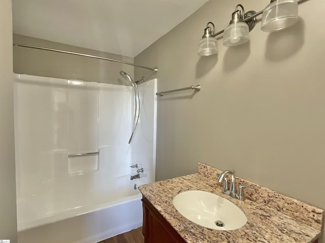 bathroom with vanity and bathtub / shower combination