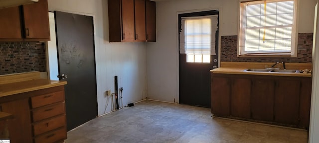 kitchen with sink and decorative backsplash