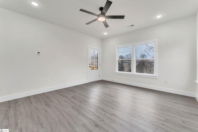 spare room featuring ceiling fan and wood-type flooring