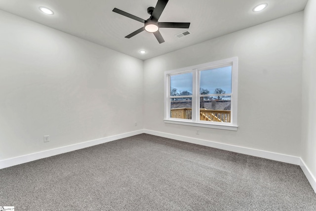 spare room with ceiling fan and carpet floors