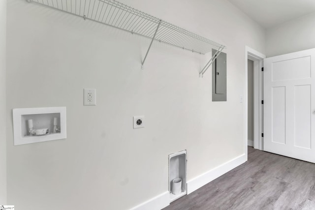 clothes washing area featuring electric panel, hookup for a washing machine, hardwood / wood-style floors, and electric dryer hookup