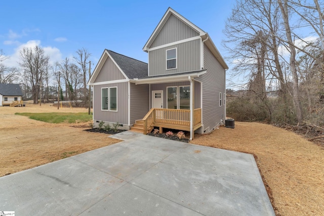 view of front of property with a front lawn, central air condition unit, and a porch