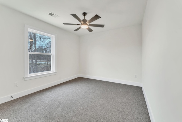 spare room featuring carpet and ceiling fan