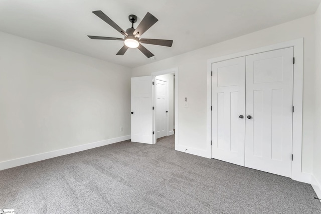 unfurnished bedroom with carpet floors, a closet, and ceiling fan