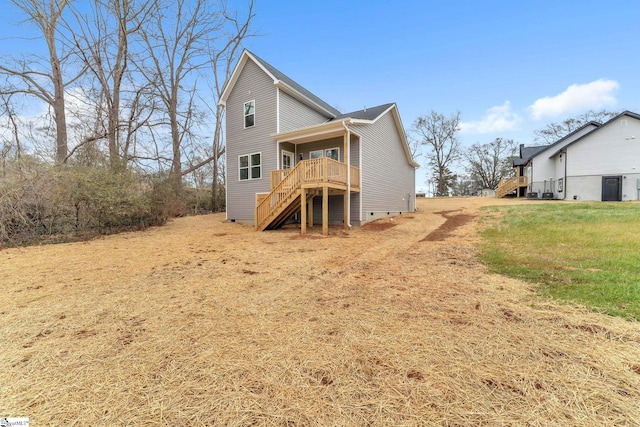 back of house with a yard