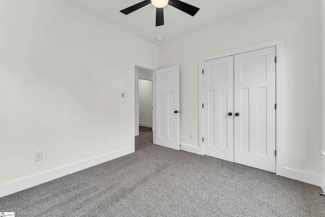 unfurnished bedroom with carpet flooring, ceiling fan, and a closet