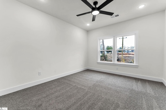 unfurnished room featuring ceiling fan and carpet flooring