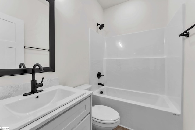 full bathroom featuring vanity, shower / washtub combination, and toilet