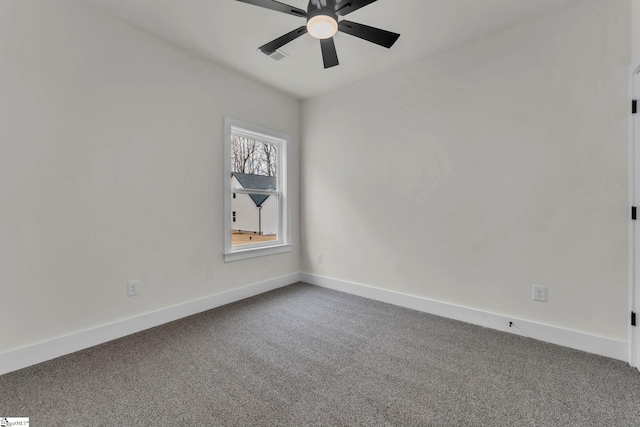 empty room with ceiling fan and carpet floors