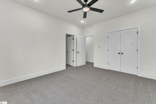 unfurnished bedroom featuring carpet floors, ceiling fan, and a closet