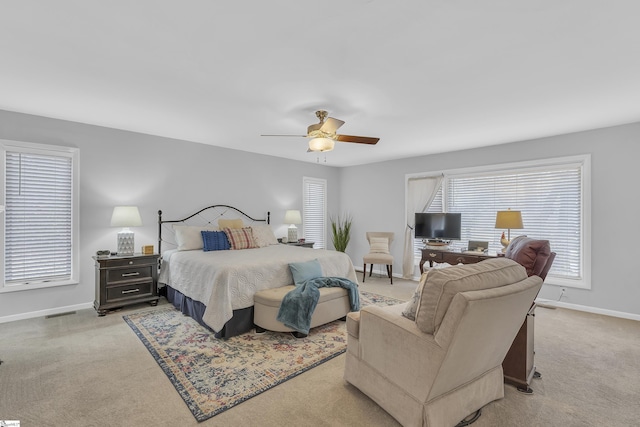 bedroom with light carpet and ceiling fan