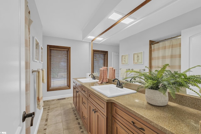 bathroom with vanity and tile patterned flooring