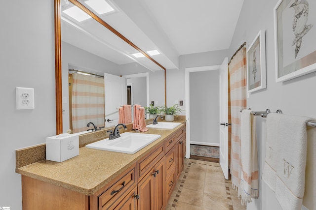 bathroom with vanity and tile patterned flooring