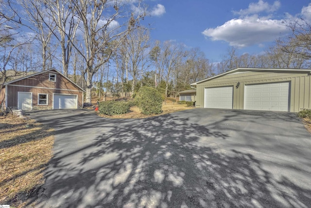 view of side of home with an outbuilding and a garage