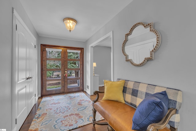 entrance foyer with hardwood / wood-style floors and french doors