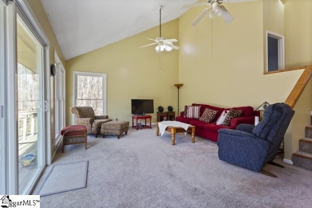 living room featuring ceiling fan, carpet, and high vaulted ceiling