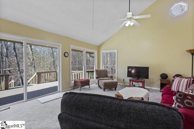 carpeted living room featuring high vaulted ceiling and ceiling fan