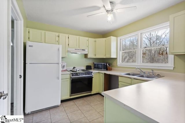 kitchen featuring electric range oven, sink, white refrigerator, light tile patterned floors, and ceiling fan