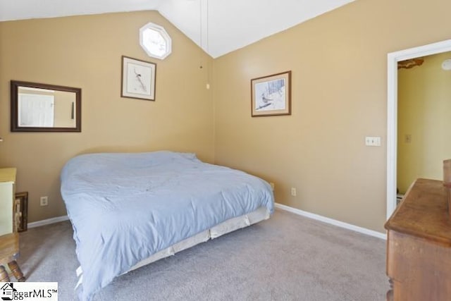 carpeted bedroom with vaulted ceiling