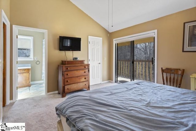 carpeted bedroom with lofted ceiling, ensuite bath, and access to outside