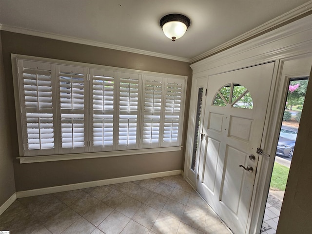 tiled foyer entrance featuring ornamental molding