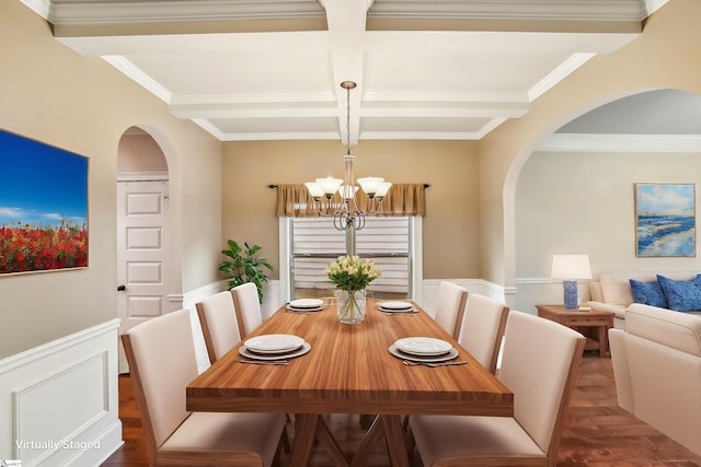 dining area featuring beamed ceiling, crown molding, coffered ceiling, and a notable chandelier