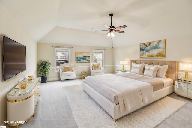 bedroom with light carpet, lofted ceiling, and ceiling fan